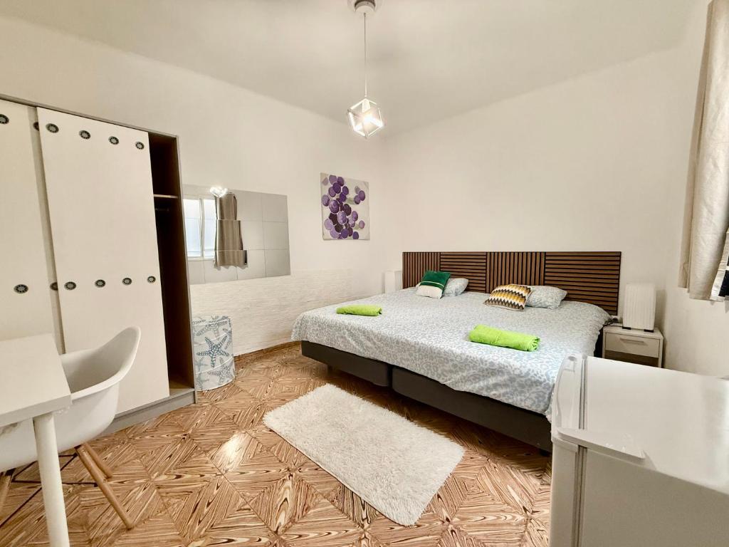 En eller flere senge i et værelse på Rooms La Laja 1