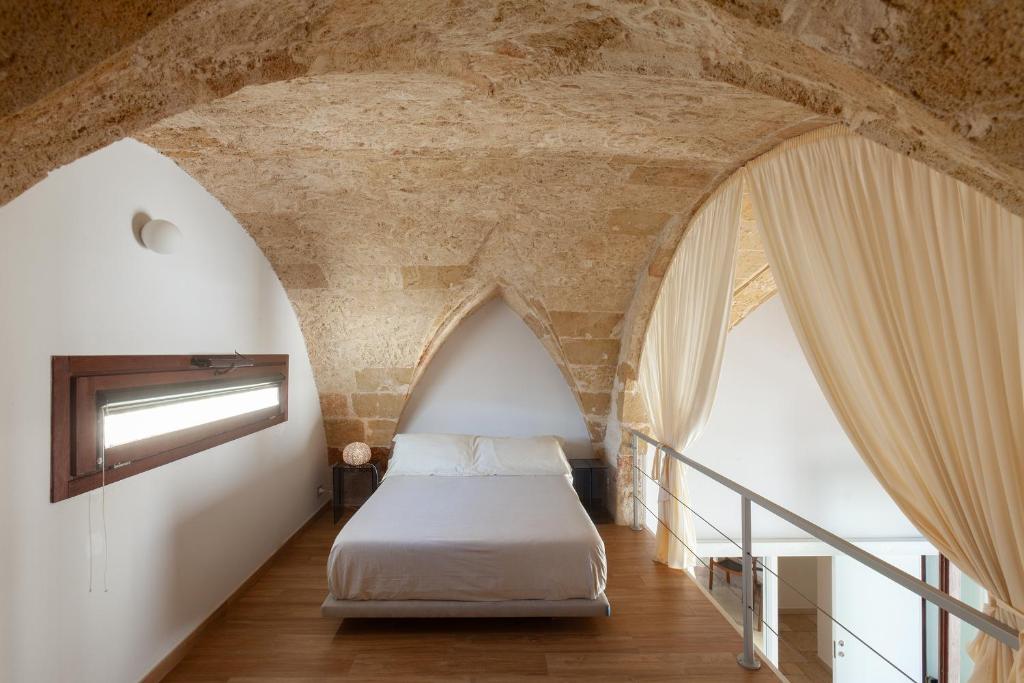 Кровать или кровати в номере Monteforte Suite & Spa