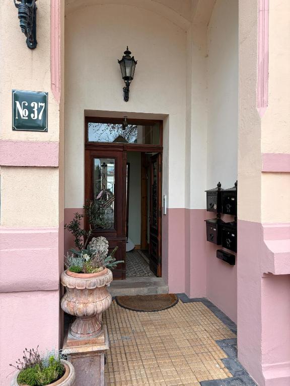 an entrance to a pink building with a door at Sophie in Lübeck