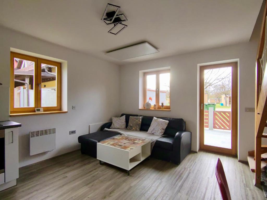 a living room with a couch and a table at Villa Petz in Brežice