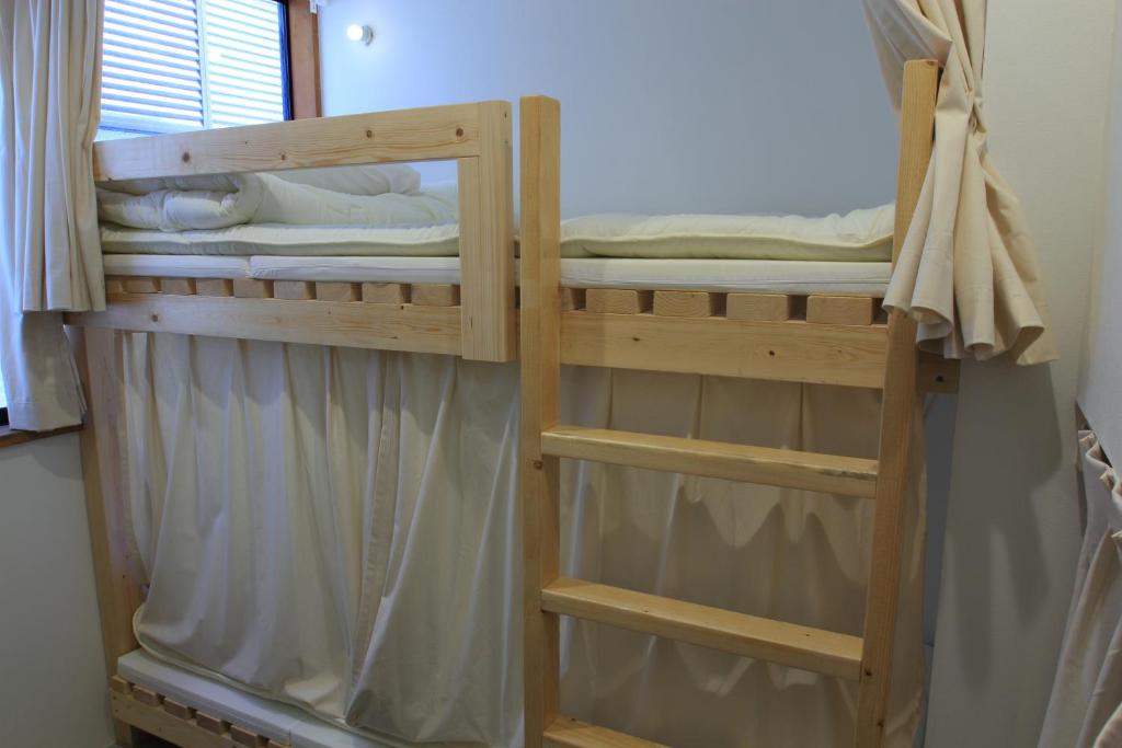 Postel nebo postele na pokoji v ubytování plumhostel