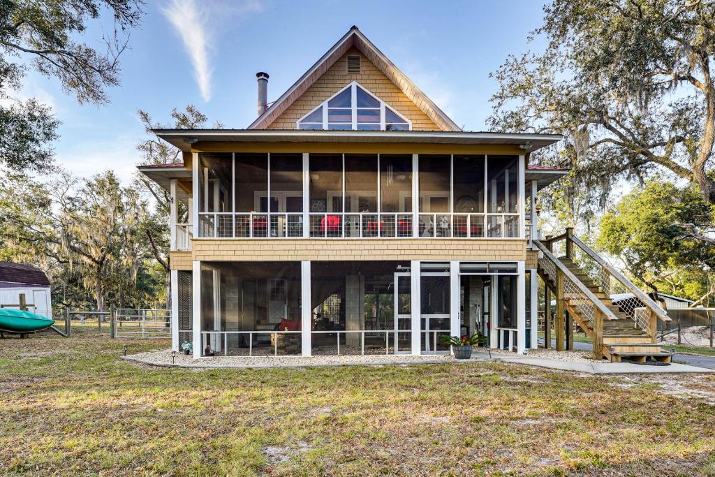a home with a large house with a slide at Dog-Friendly Home w/ Dock on Suwannee River! in Fanning Springs