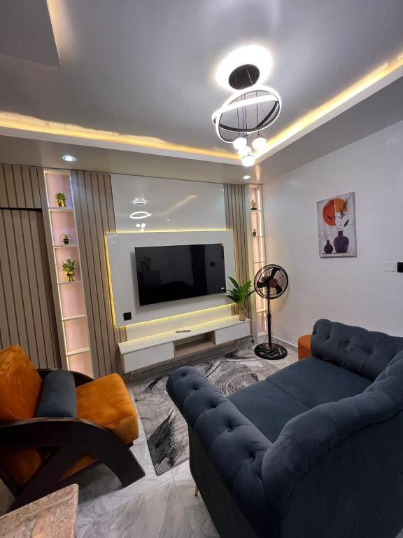 Телевизор и/или развлекательный центр в Luxury & Chic Apartment in Anthony, Maryland, Lagos, 7 mins from Ikeja Airport