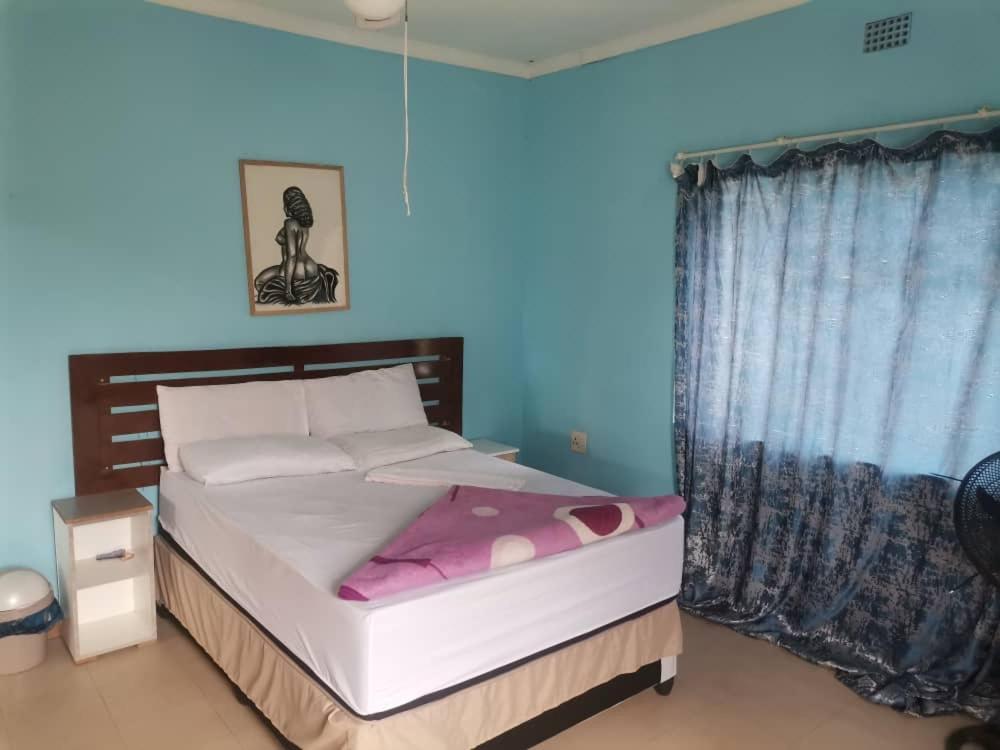 Postel nebo postele na pokoji v ubytování Fairview North Guest House