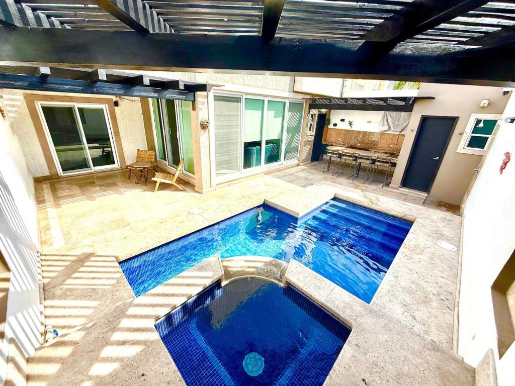 Bazén v ubytování Villa Alberca, Bar y Terraza Privada nebo v jeho okolí