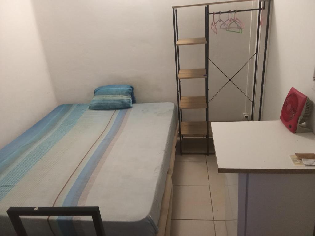 Ένα ή περισσότερα κρεβάτια σε δωμάτιο στο chambre sur fdf