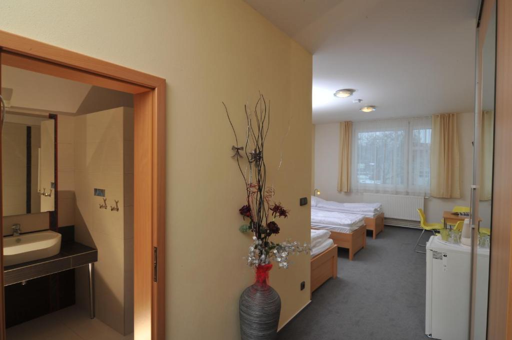 Postel nebo postele na pokoji v ubytování Pension Milk Inn
