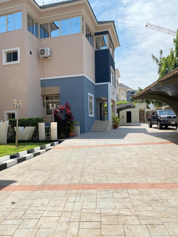 a driveway in front of a building at Glovis Hospitality in Abuja
