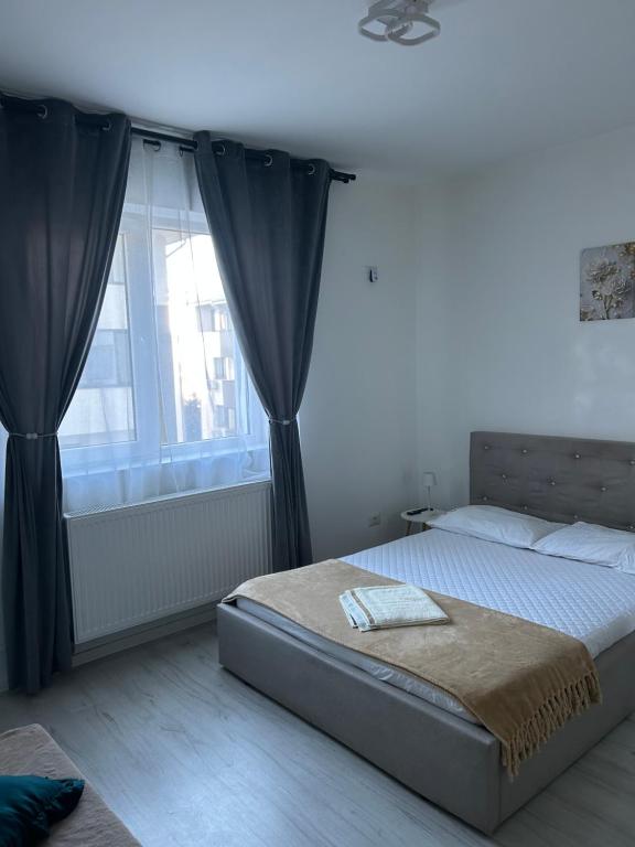 Postel nebo postele na pokoji v ubytování BellaHome Residence