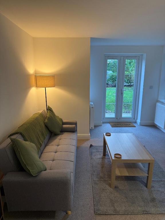 a living room with a couch and a coffee table at Relaxing Coastal Flat, Perfect Location in Southbourne