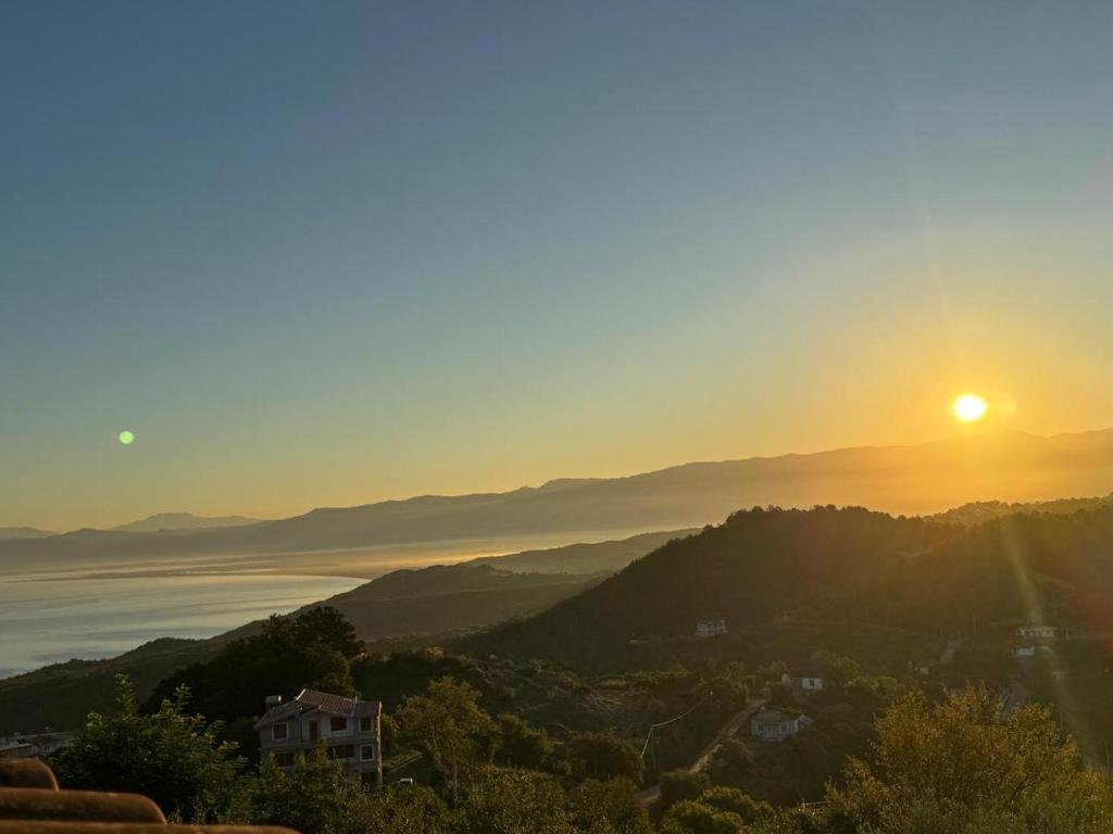 a view of the sun setting over the ocean at TwinSeas in Draç