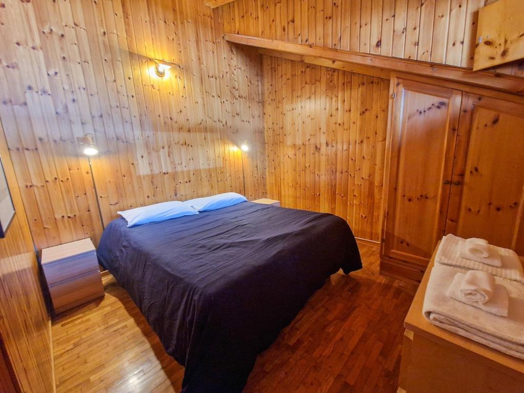 En eller flere senge i et værelse på Coccola Zoldana - Lovely apartment 2BR