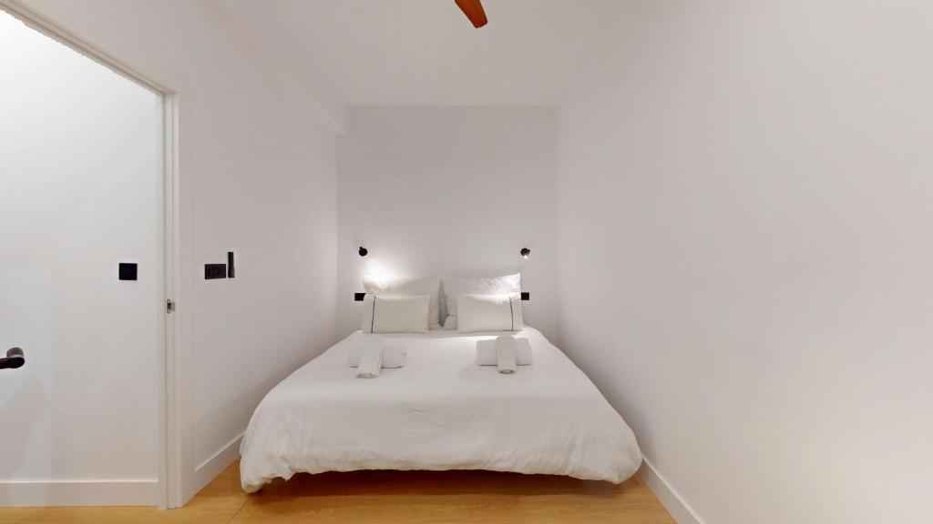 Ένα ή περισσότερα κρεβάτια σε δωμάτιο στο Bilbao City Center