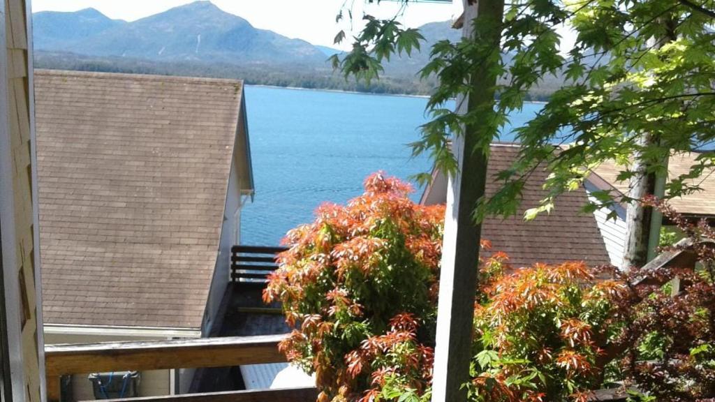 a view of a lake from the balcony of a house at Hummingbird downtown water view apartment in Ketchikan