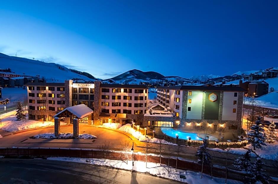 a hotel in the snow at night at Walk to Mountain Base Studio for 4 & POOL in Crested Butte