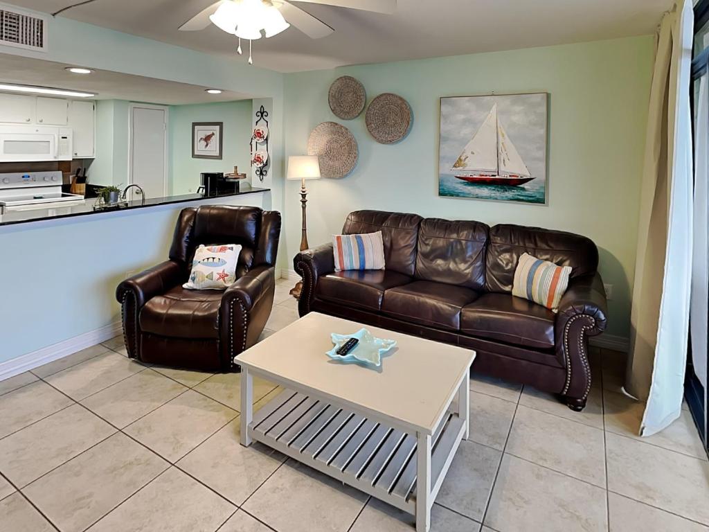 a living room with a couch and a table at Laguna Reef #214 - Retreat on Rockport Bay in Rockport