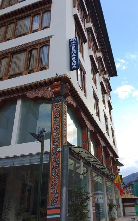 a building with a sign in front of it at Hotel pema raga in Thimphu