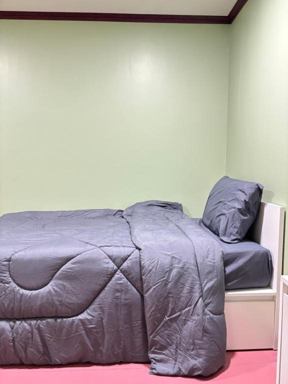 En eller flere senge i et værelse på Milo House