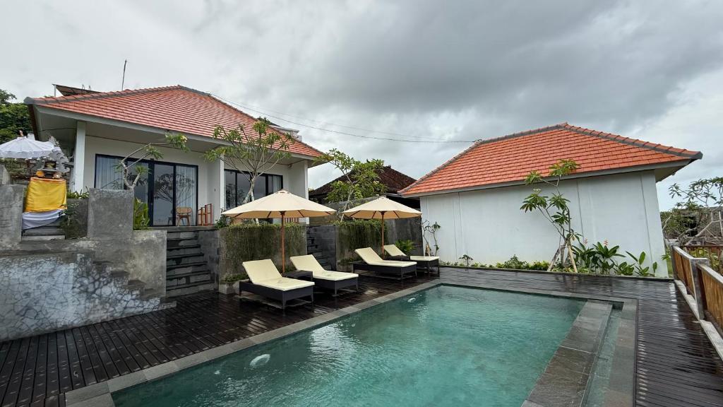 Bazén v ubytování Umah 610 nebo v jeho okolí