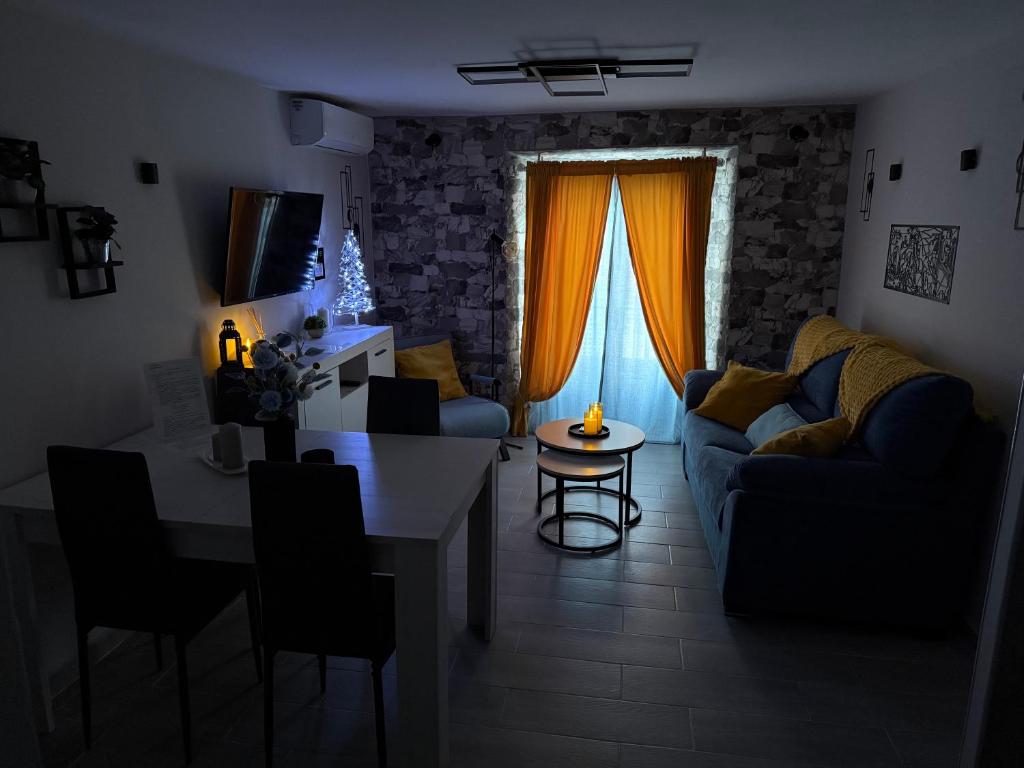 a living room with a couch and a table at El Boulevard de Trujillo 1997 in Trujillo