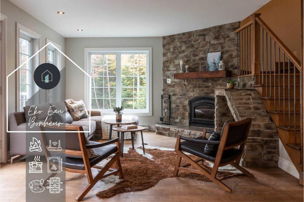 a living room with a couch and a fireplace at Eko Eau Bonheur in Saint Adolphe D'Howard