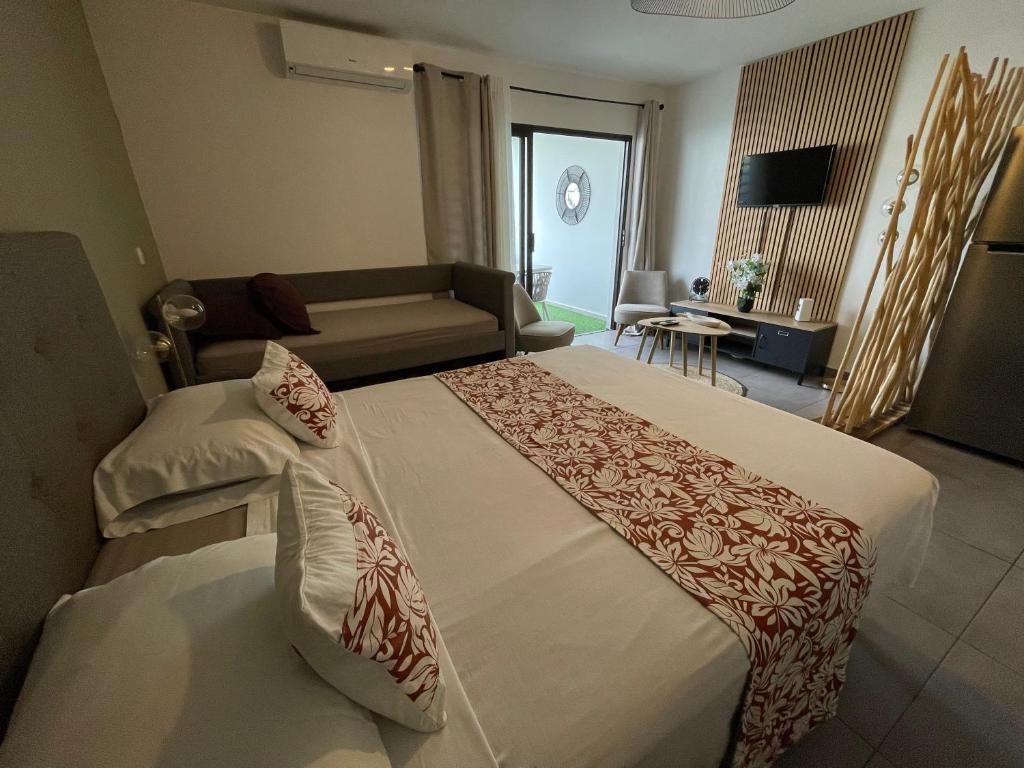 Una cama o camas en una habitación de Stay In Tahiti