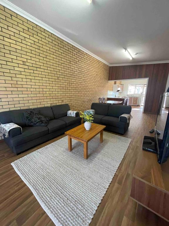a living room with a couch and a coffee table at Central on Smith in Kalbarri