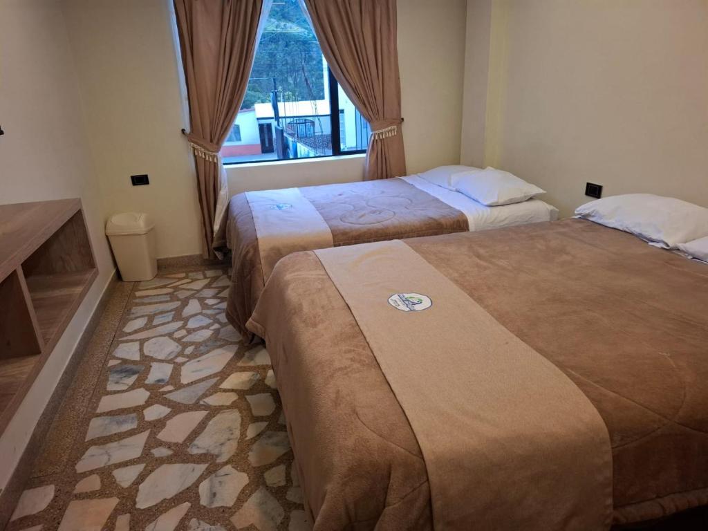 Un pat sau paturi într-o cameră la Hotel Las Lajas Confort Ipiales