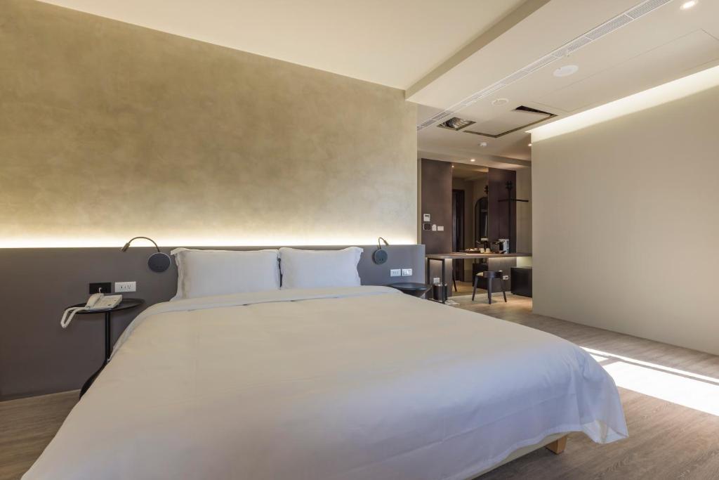 Postel nebo postele na pokoji v ubytování SUPERB HoTEL