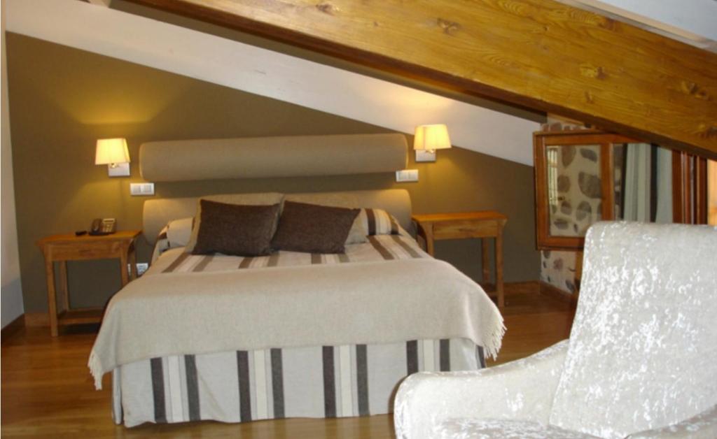 Posteľ alebo postele v izbe v ubytovaní Hostal Casa Masip
