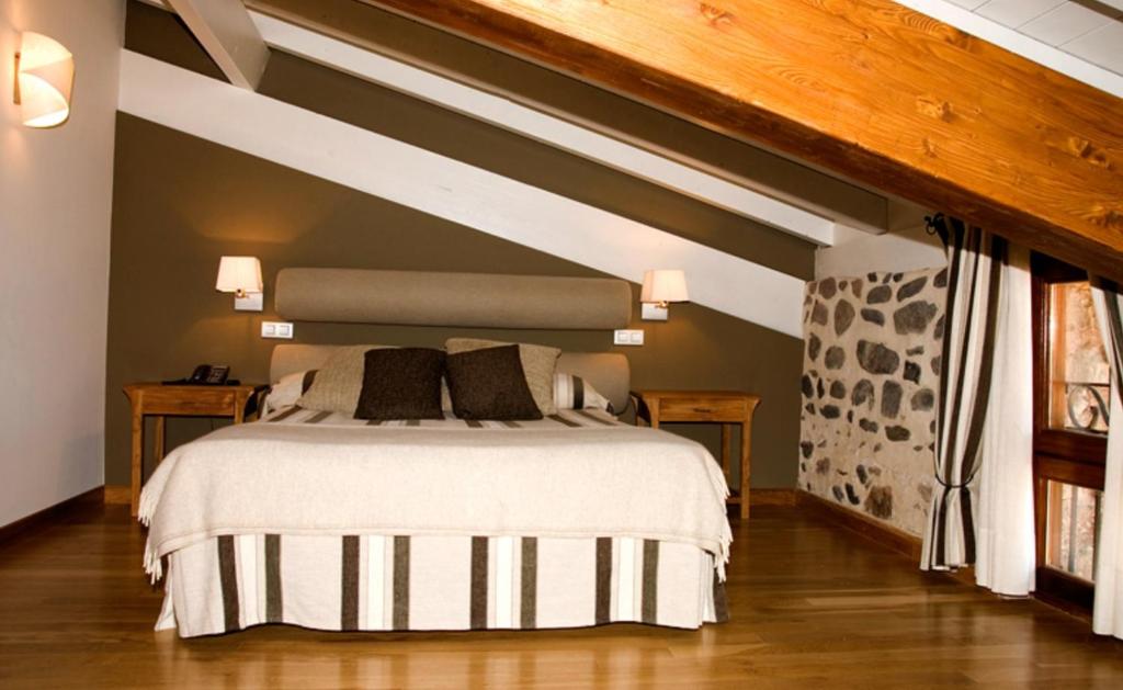 Posteľ alebo postele v izbe v ubytovaní Hostal Casa Masip