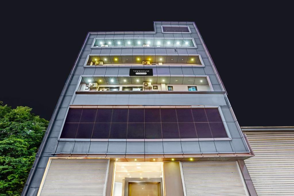 a tall building with a lot of solar panels on it at Super Townhouse Sector 9 Gurgaon in Gurgaon