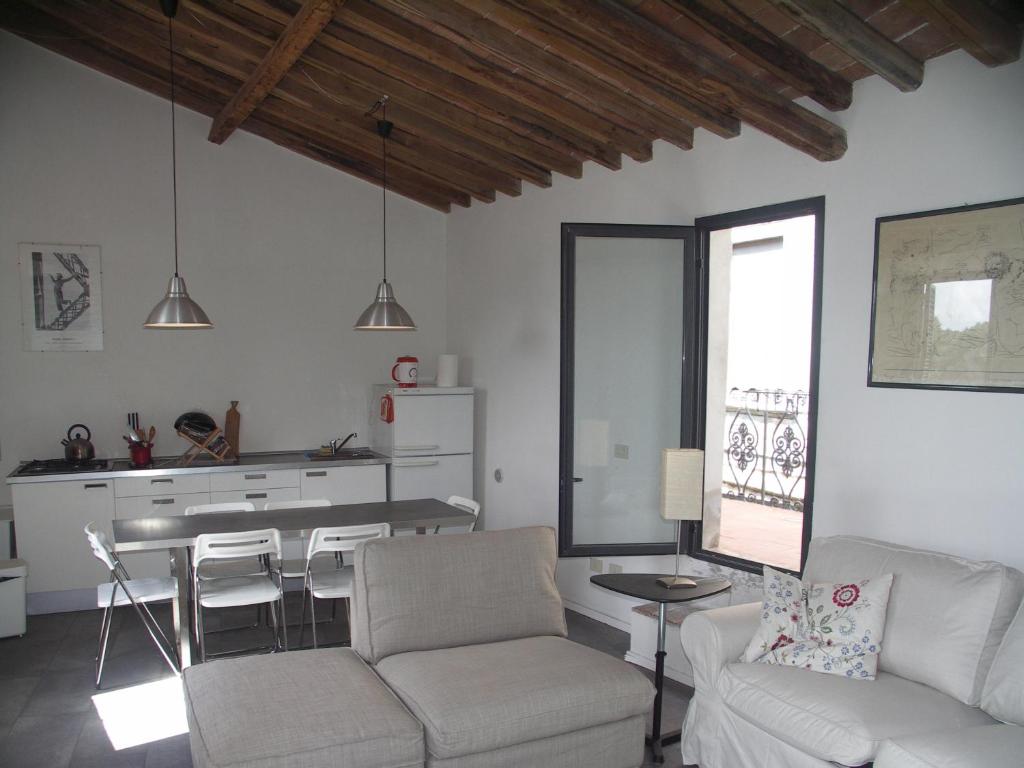 a living room with a couch and a table at La Crisalide in Sorano