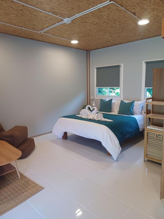 Ένα ή περισσότερα κρεβάτια σε δωμάτιο στο Pradu House Koh Yao Noi