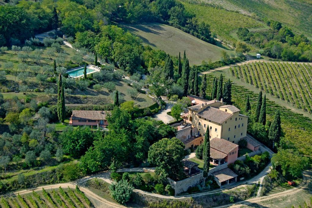 an aerial view of a house in a vineyard at Il Borghetto Tuscan Holidays in San Gimignano