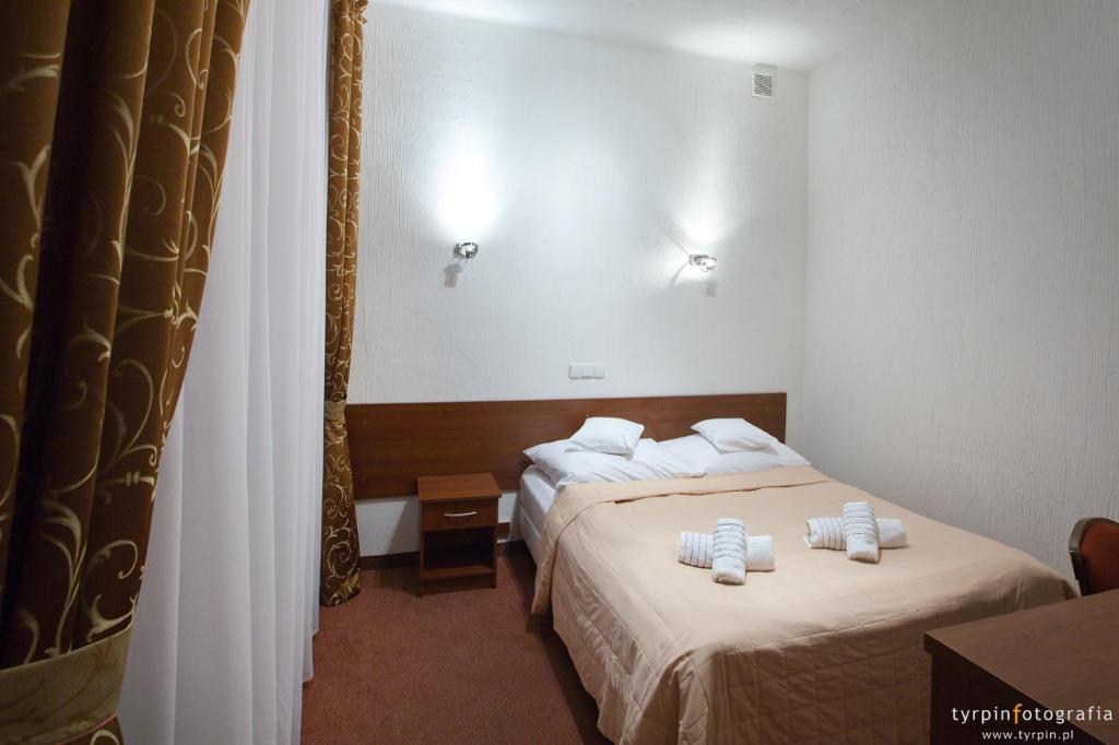 Postel nebo postele na pokoji v ubytování Zajazd Polonez