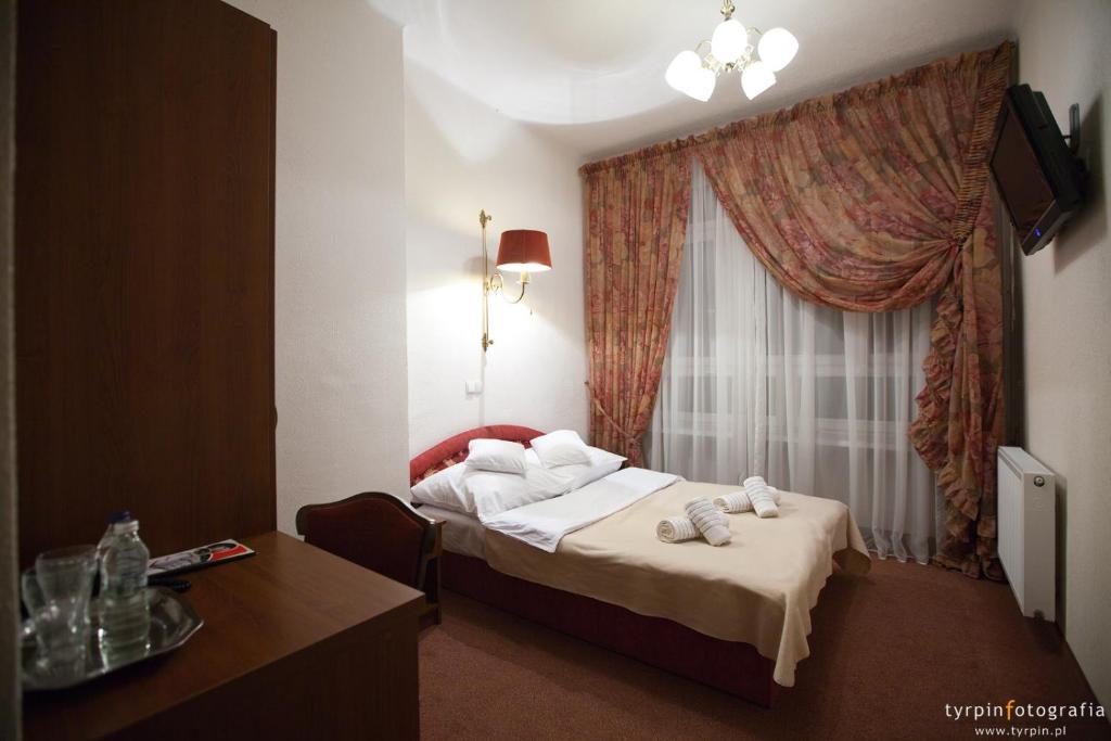 Postel nebo postele na pokoji v ubytování Zajazd Polonez