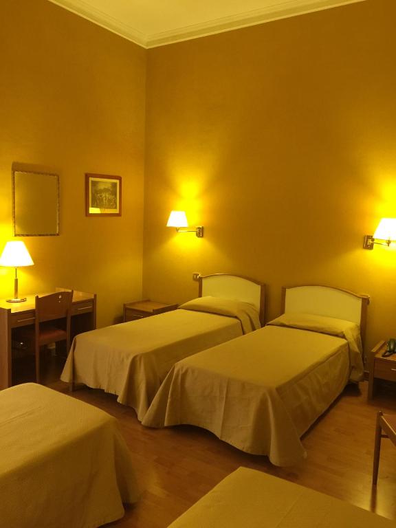 Postel nebo postele na pokoji v ubytování Hotel Relais Filonardi