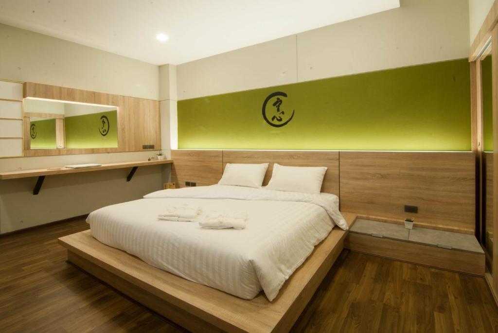 Postel nebo postele na pokoji v ubytování The Zenith Residence Hotel