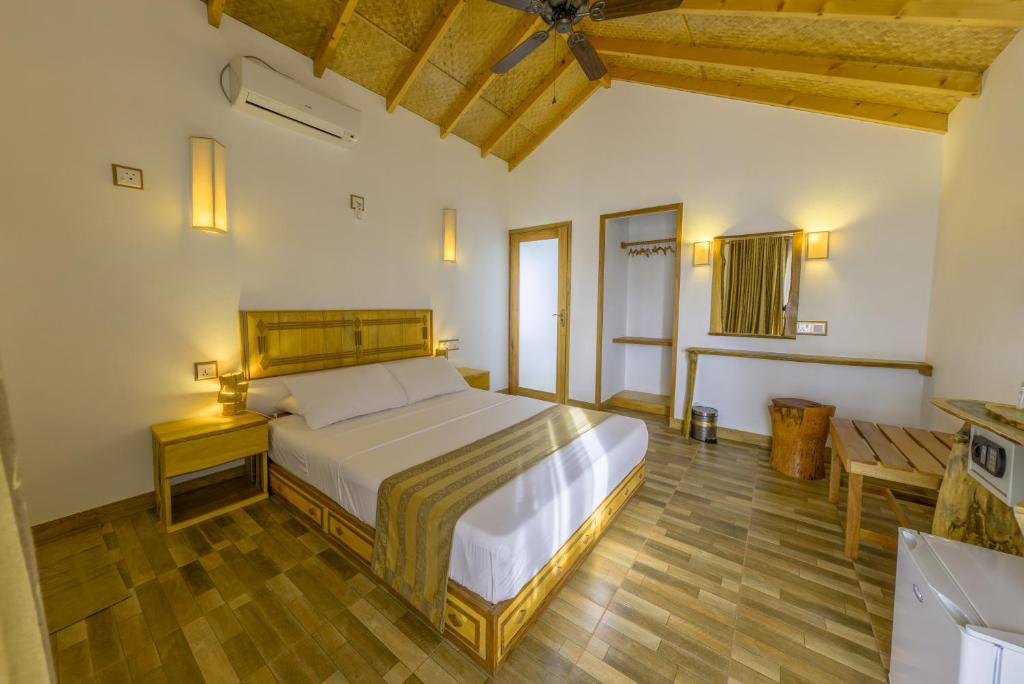 Postel nebo postele na pokoji v ubytování Ameera Maldives