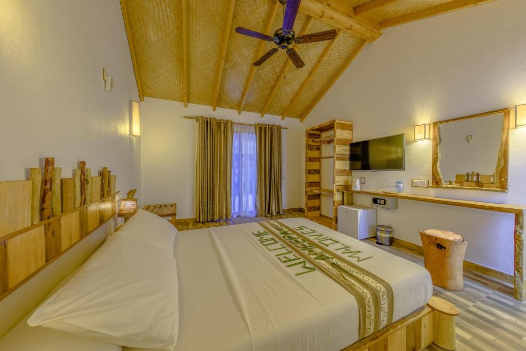 Postel nebo postele na pokoji v ubytování Ameera Maldives
