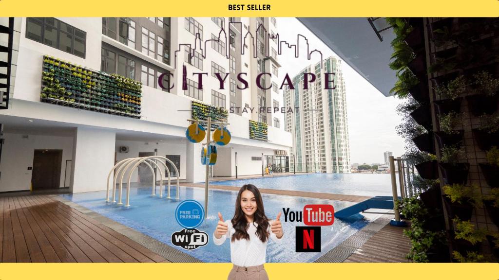 a woman standing in front of a large building at Space Residency Johor Bahru near KSL City Mall by Cityscape in Johor Bahru