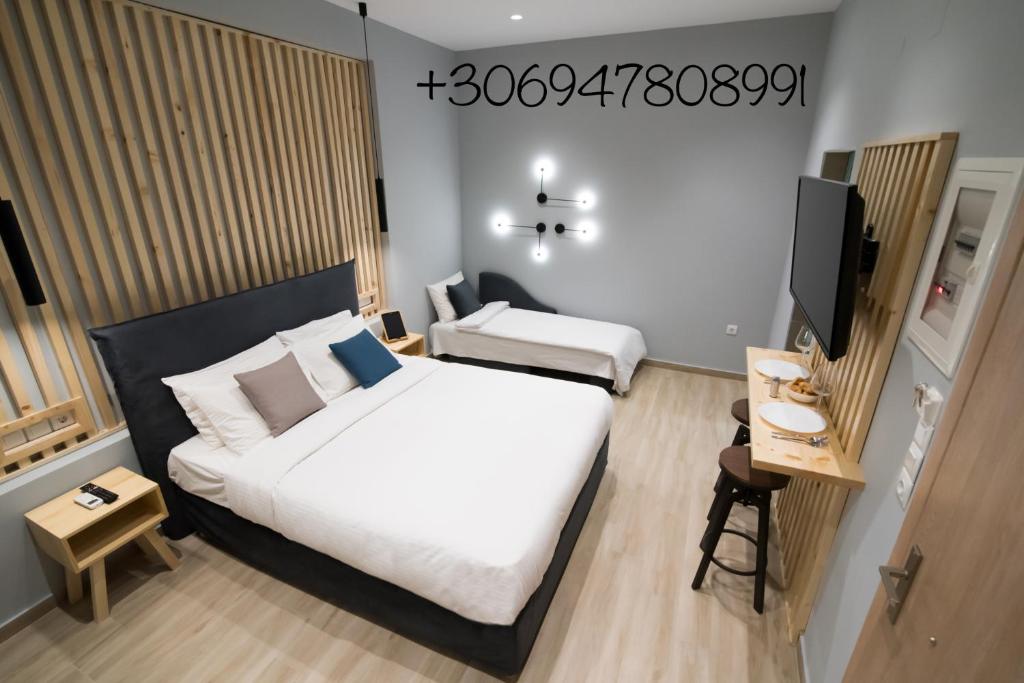 Postel nebo postele na pokoji v ubytování Preveza Suitestay Apartments Dodonis 28