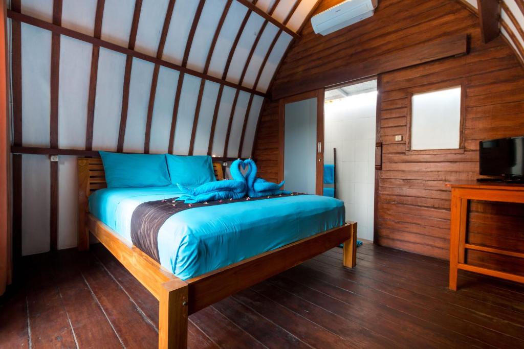 Postel nebo postele na pokoji v ubytování Little Coco Gili Trawangan Hotel
