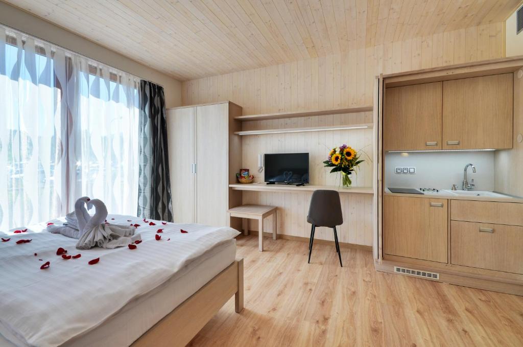 Postel nebo postele na pokoji v ubytování Green Inn Hotel
