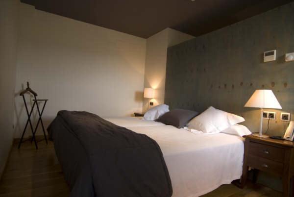 Postel nebo postele na pokoji v ubytování Hotel Boutique El Convento de Mave