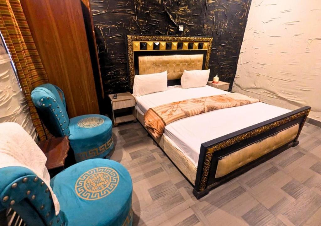 Postel nebo postele na pokoji v ubytování Hayat Palace Hotel Upper Mall