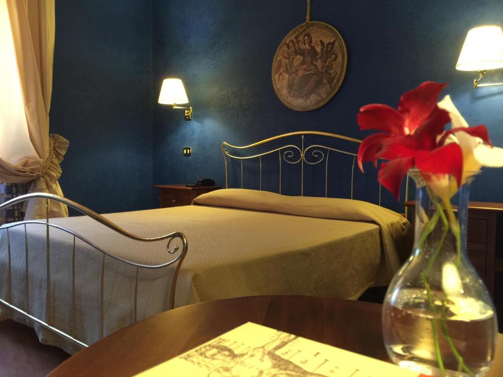 Postel nebo postele na pokoji v ubytování Hotel Relais Filonardi