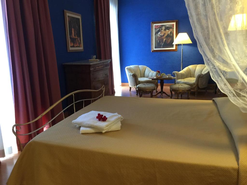 Postel nebo postele na pokoji v ubytování Hotel Relais Filonardi