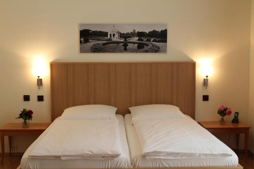 Postel nebo postele na pokoji v ubytování Hotel Sollner Hof